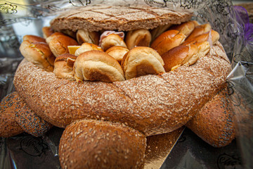  Bunch of sliced French breads and sandwiches in a basket. 