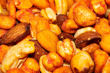 A mixture of different nuts. Healthy food, fitness diet. Surface texture. Close up.