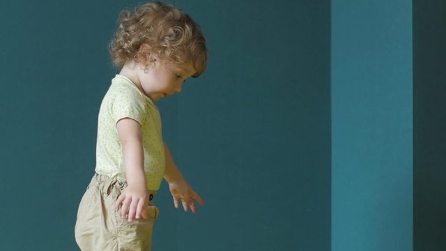 Girl is playing with Cheerleader's pompoms
