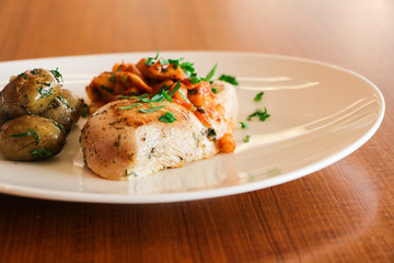 GRILLED CHICKEN BREAST , HERBED ROASTED BABY POTATO, WHITE BEAN AND MUSHROOM CASSEROLE