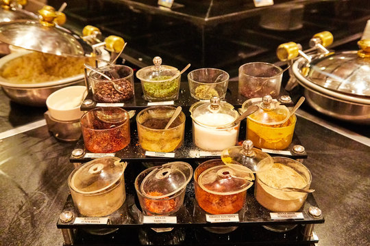 Food On The Shelves In The Self-service Buffet With All Inclusive In Hotel In Turkey. Many Types Of Spices In Jars