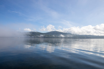 Lake Yamanaka in Japan is foggy in the morning.