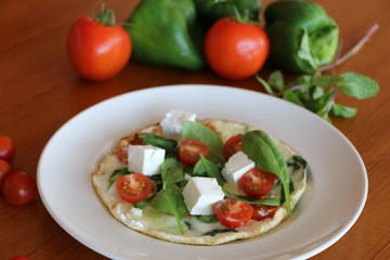 Egg white omelet, Egg white omelet filled with baby spinach,
cherry tomato, feta cheese and protein bread