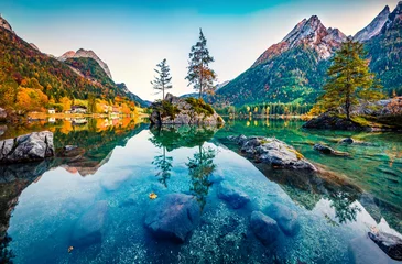 Poster Astonishing autumn view of Hintersee lake with Hochkalter peak on background, Germany, Europe. Calm morning view of Bavarian Alps. Beauty of nature concept background. © Andrew Mayovskyy