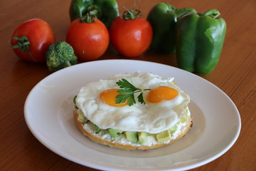 Avocado on Bagel, Fresh avocado, cream cheese on bagel top with your choice of poached eggs or sunny side up eggs