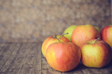 apples on wooden table