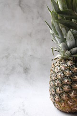pineapple on a wooden table © AMTM