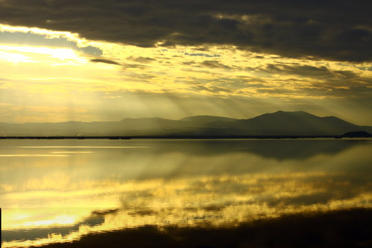 Beautiful sunset with its reflection at Karla lake , central Greece