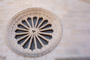 rose window of an old building in Kotor