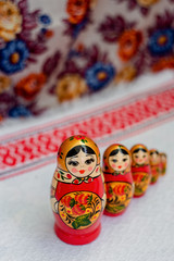 painted nesting dolls on a bright background