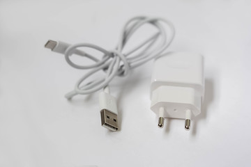 Fototapeta premium white phone charger on a white background