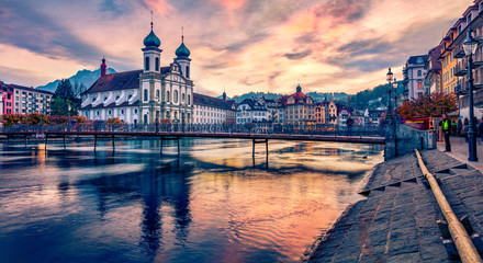 Naklejka na ściany i meble Magnificent evening view of Jesuitenkirche Church. Fantastic autumn cityscape of Lucerne. Stunning outdoor view of Switzerland, Europe. Traveling concept background.