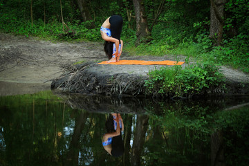 Fototapeta na wymiar Yoga position in the forest 