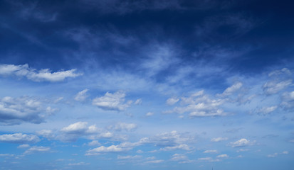Fototapeta premium Bright beautiful blue sky with soft clouds, bright sunny day