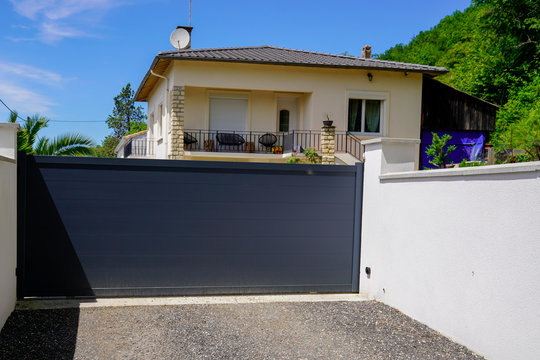 Aluminum dark gray metal gate to house with portal black to access home