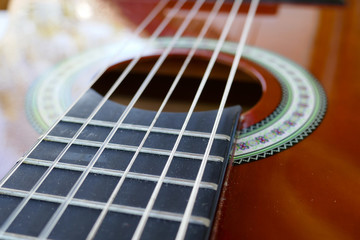 Acoustic guitar background and strings. Children's classic guitar. Soundboard and vulture.