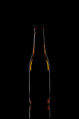 Silhouette of a beer bottle on black background