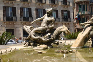 Fototapeta na wymiar Italy Sicily Syracuse ,07/03/2007: Ortigia Island, the Diana fountain is a monumental fountain from 1907 by Giulio Moschetti 