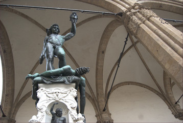 Florence, Italy - Perseus defeats Medusa sculpture, made by Benvenuto Cellini and located in Loggia dei Lanzi, in Piazza della Signoria