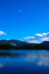 Beautiful landscape, lake and mountains of the Alps in Austria. Rest for tourists.