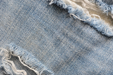 Old blue jeans texture close-up. Denim background. Top view