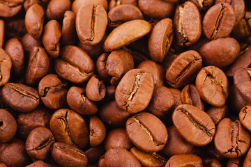 texture of roasted coffee beans close-up, top view. 