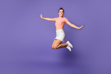 Fototapeta na wymiar Full length body size view of her she nice attractive lovely pretty cute cheerful cheery girl jumping spending vacation isolated on bright vivid shine vibrant lilac violet purple color background