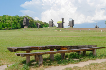 Fototapeta na wymiar Windmills in Pirogovo Open-Air Museum - Kiev, Ukraine