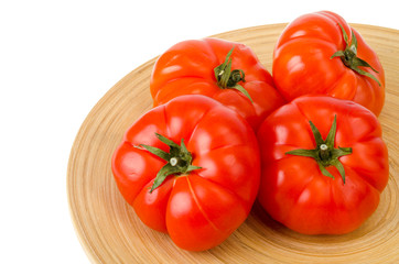 Red ripe juicy beeftomats isolated on white background