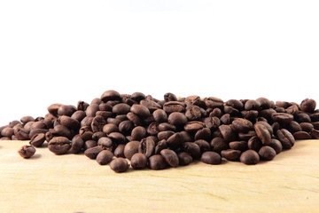 Coffee beans stacked on the wood floor