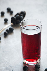 A glass full of blueberry juice