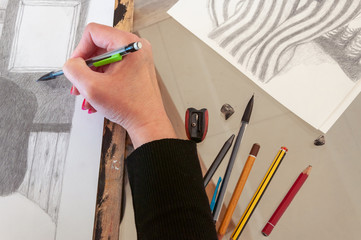 Artist drawing a pencil illustration