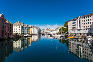 Alesund, Norway - June 2019: Great summer view of Alesund port town on the west coast of Norway, at the entrance to the Geirangerfjord. Old architecture of Alesund town in city centre.