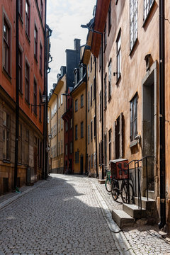 View of narrow cobblestoned street in Gamla Stan, the medieval Old Town of Stockholm