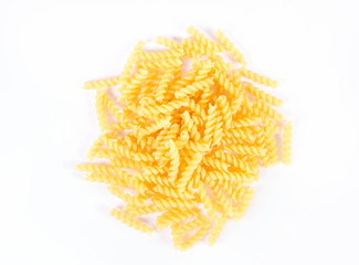 Raw fusilli pasta on a white background