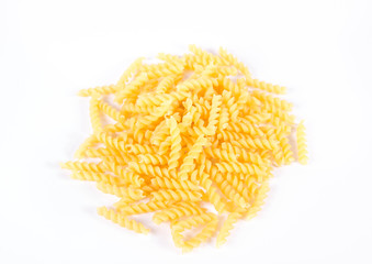 Raw fusilli pasta on a white background