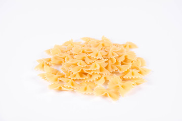 Raw Farfalle pasta on a white background