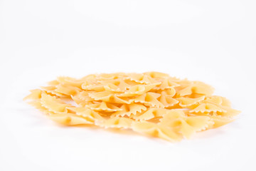 Raw Farfalle pasta on a white background