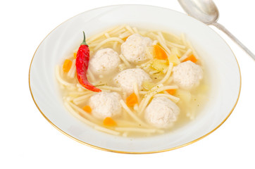 Broth with noodles and meat balls. Photo
