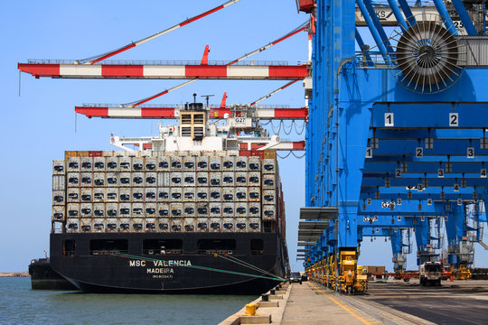 Large Container Ship Loaded With Stacks Of Refrigerated Containers.
