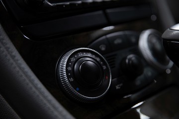 Fototapeta na wymiar Car air conditioner regulator. Modern car interior