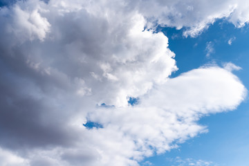 Beautiful sky with volumetric clouds, and the rays of the sun.