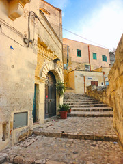 old narrow medieval street and picturesque stone houses in historical city of Matera, Basilicata Italy     