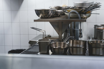 Pans, pots and various utensils in commercial professional kitchen