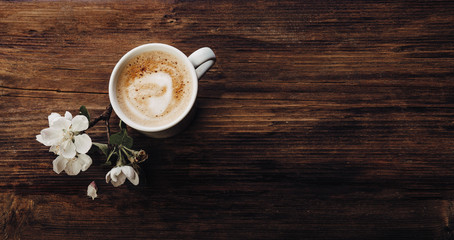 A cup of coffee on a wooden table