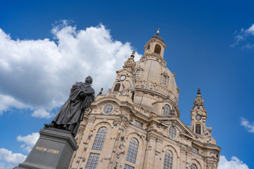 Fototapeta na wymiar Frauenkirche with Martin Luther Statue during the Daytime in Dresden, Germany