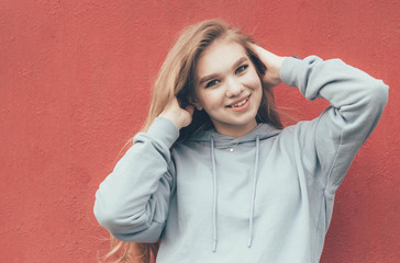 smiling girl on a red background