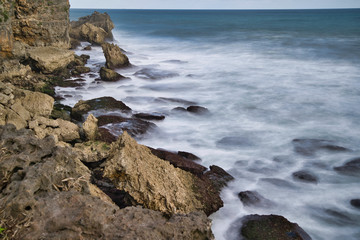 Fototapeta na wymiar waves crashing on rocks