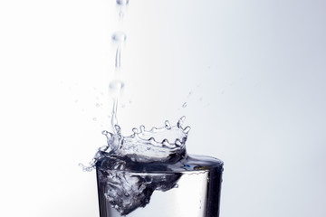 water falling into a clear glass