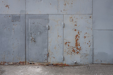 abstract background of an old lined with metal warehouse wall